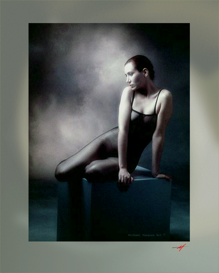 Near color of a model in black tights, sitting on a cube,